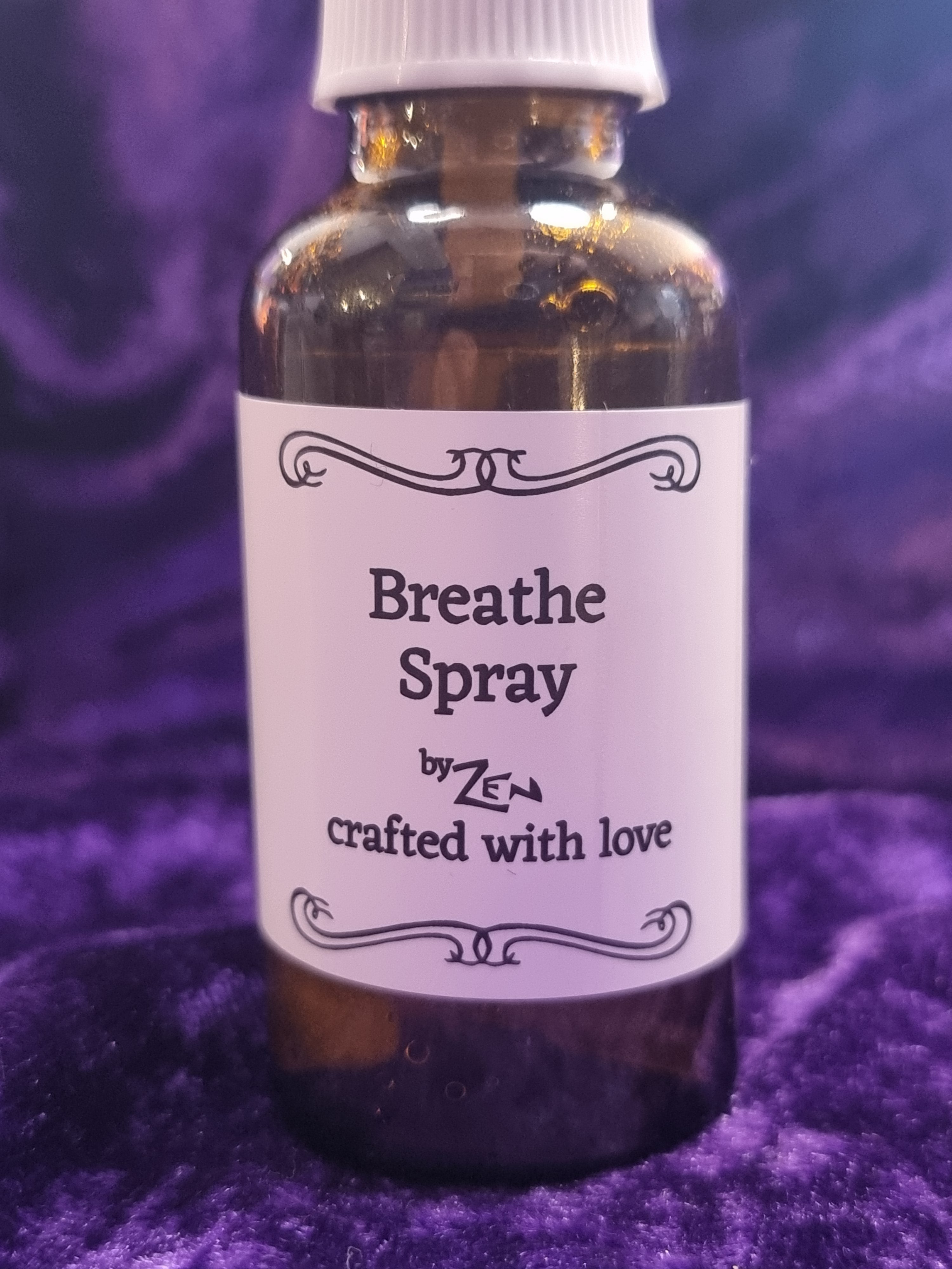 Bottle of 'Breathe Spray' with a purple background