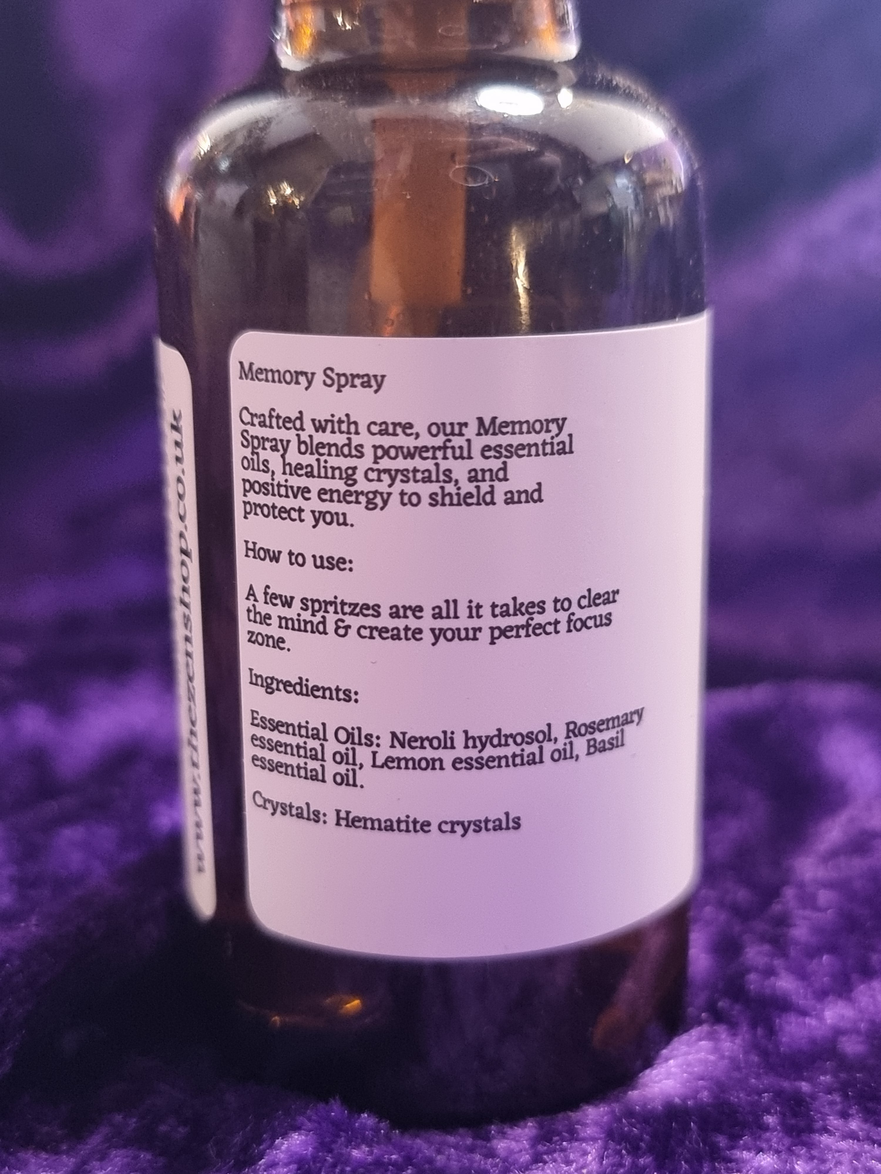 Bottle of moon spray with label on a purple background