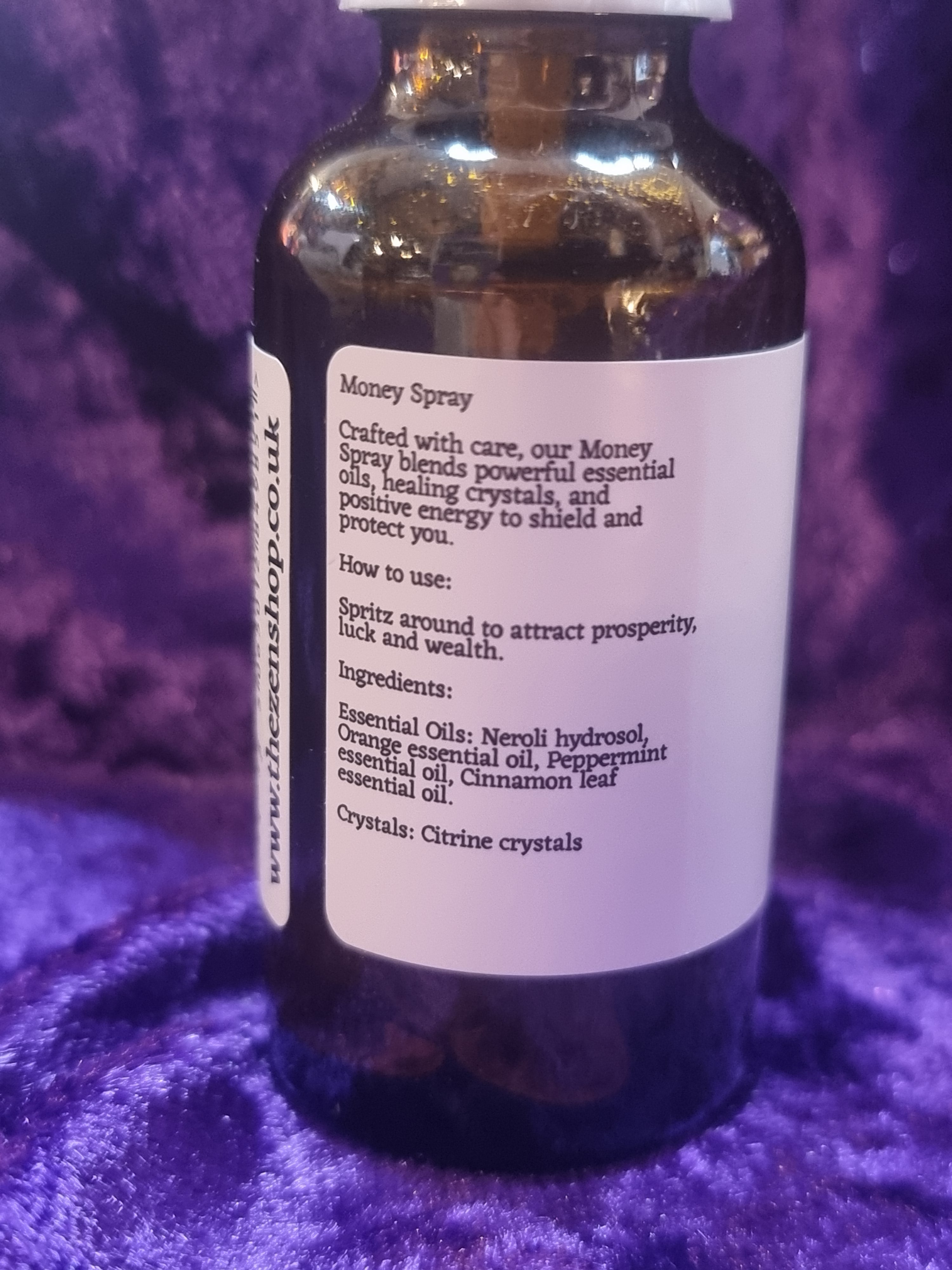 Bottle with label on a purple textured surface