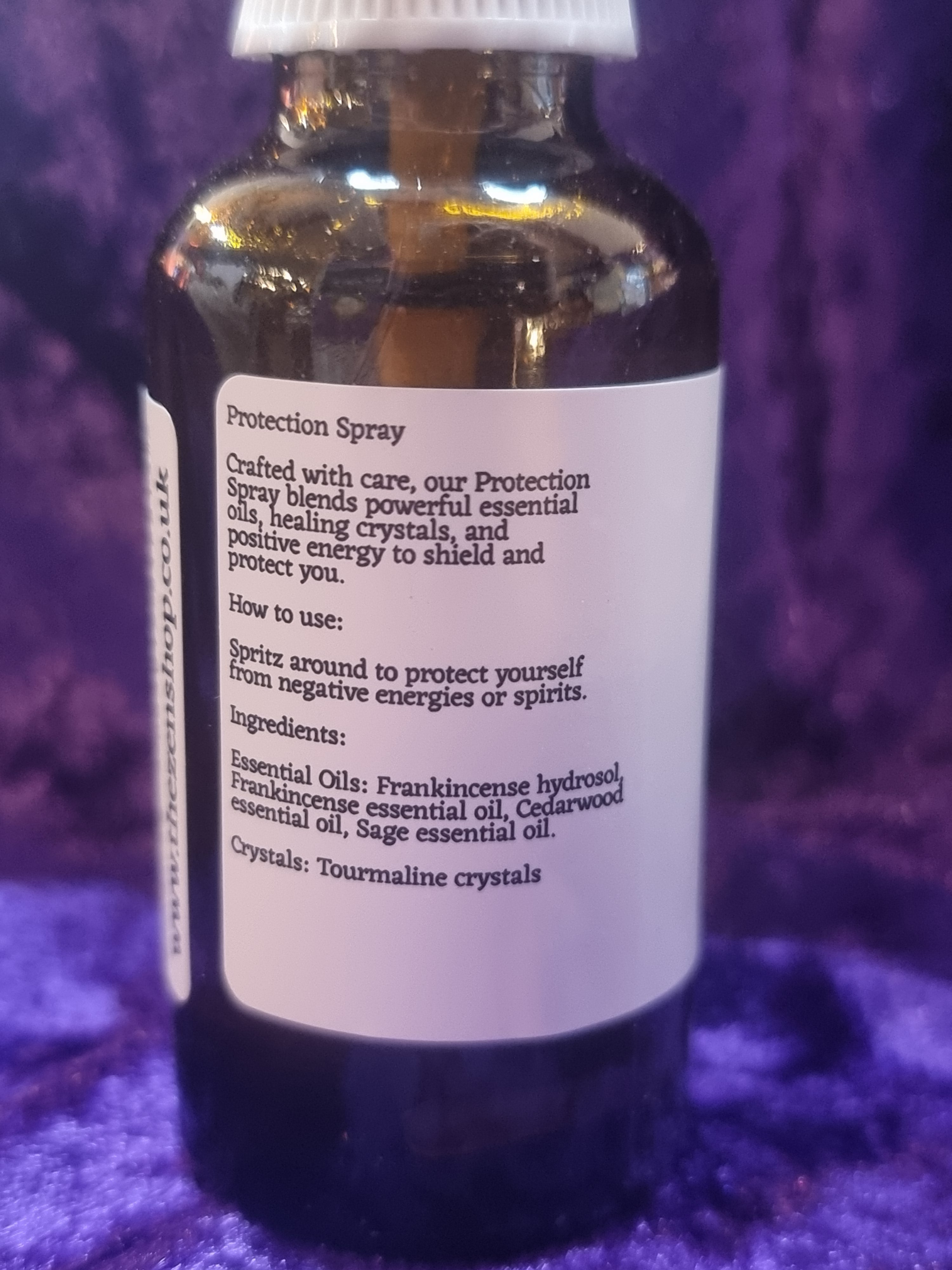 Bottle with label on a purple textured surface