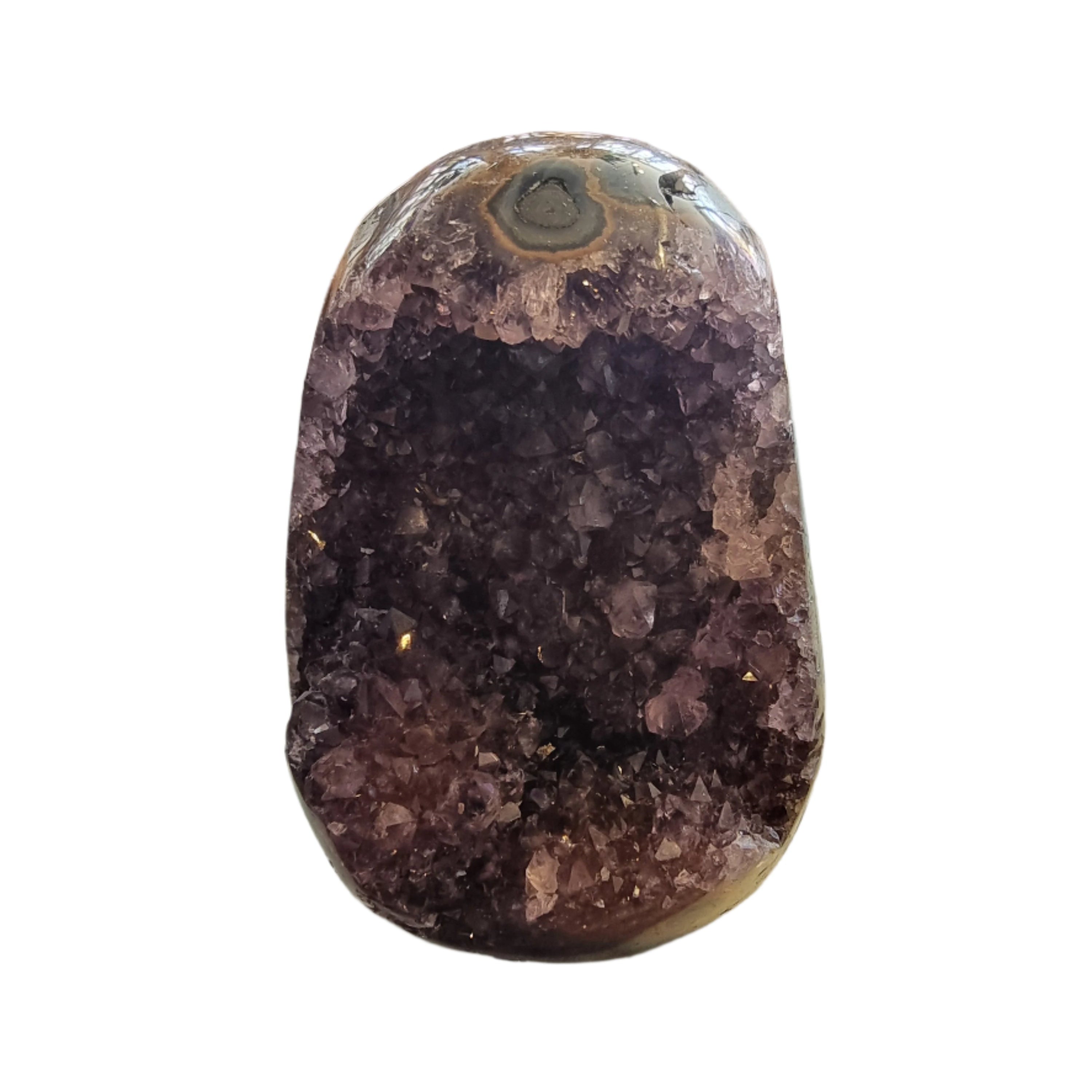 A rough Amethyst Geode with a purple and white patterned interior visible through the transparent outer shell.