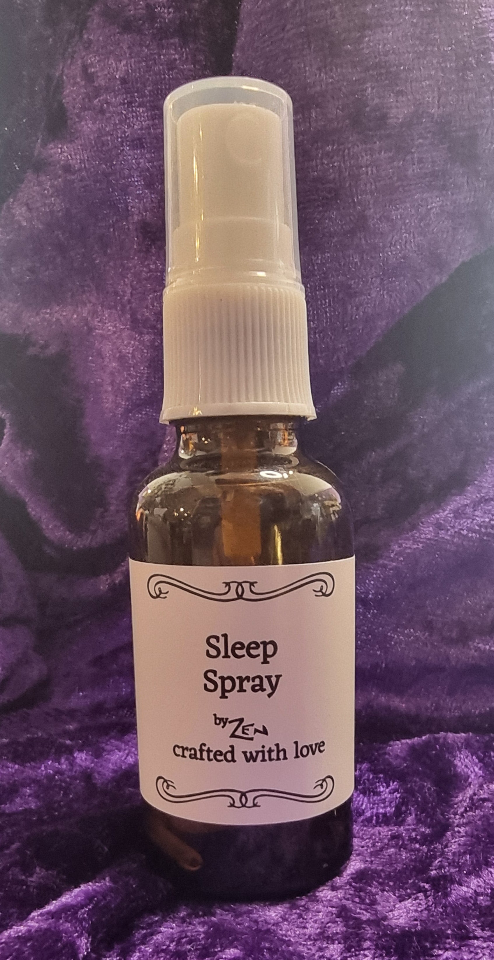 Small bottle with a label on a purple textured surface