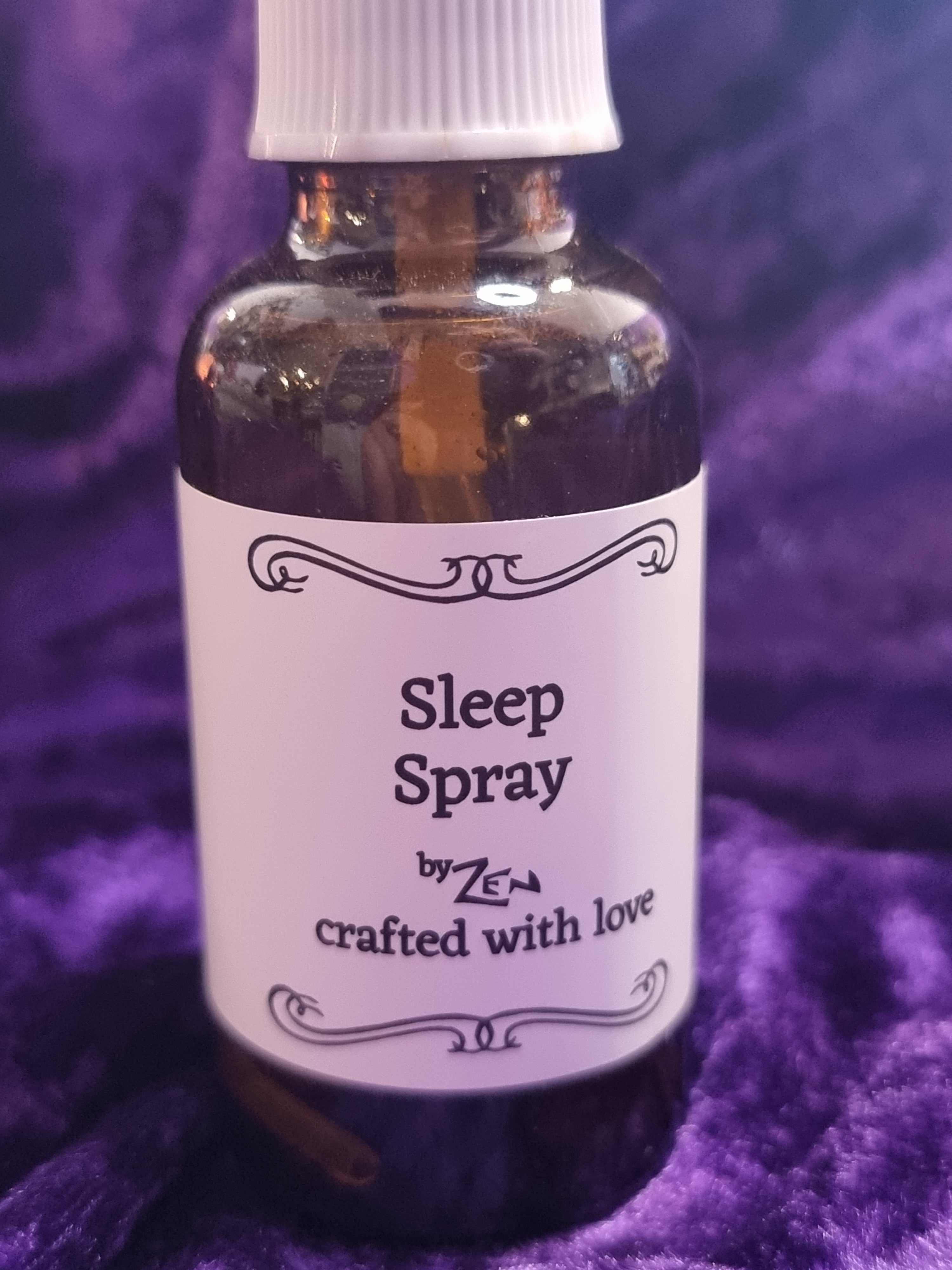 Bottle of sleep spray with a purple background