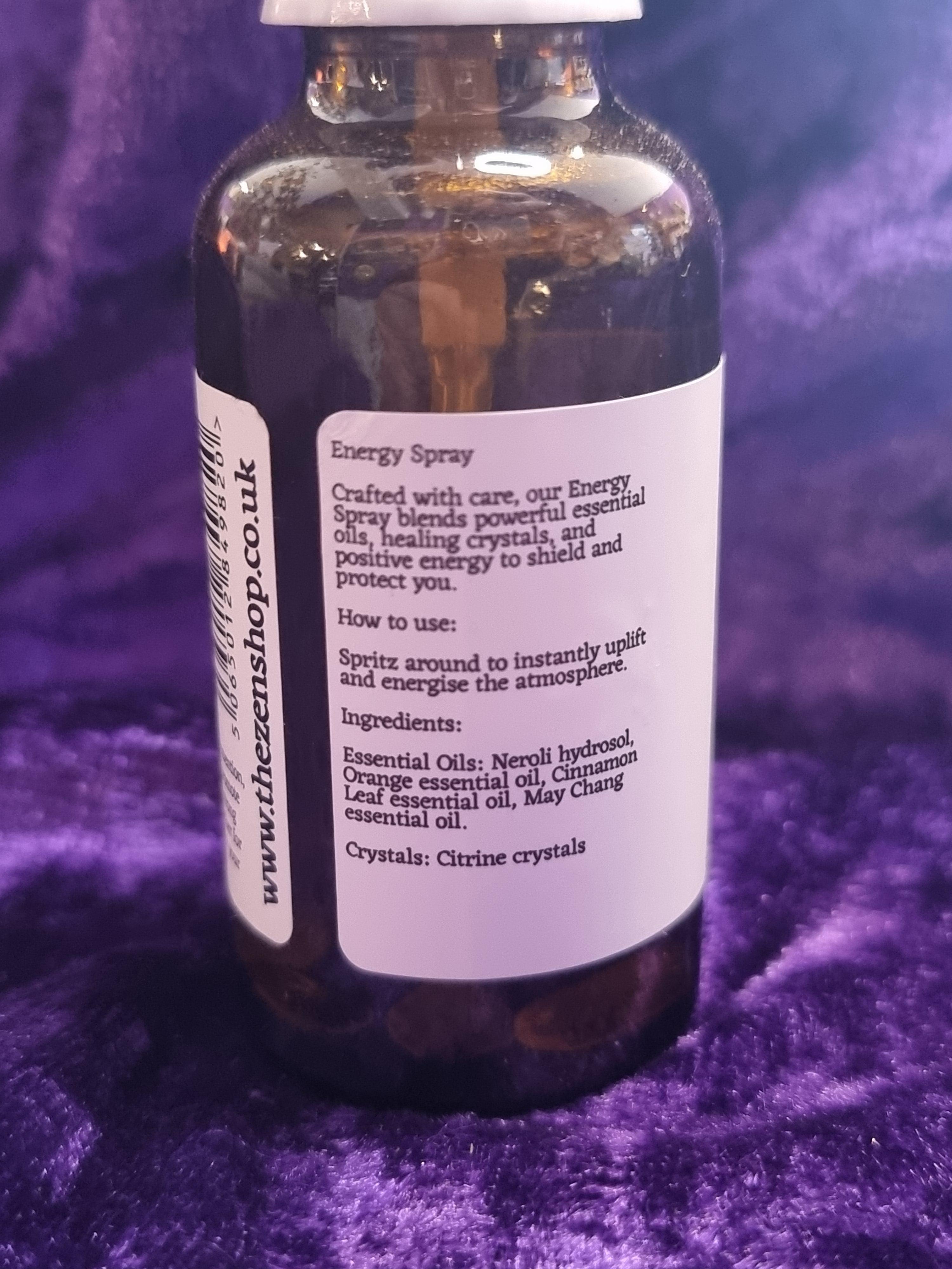 Bottle with a label on a purple textured background