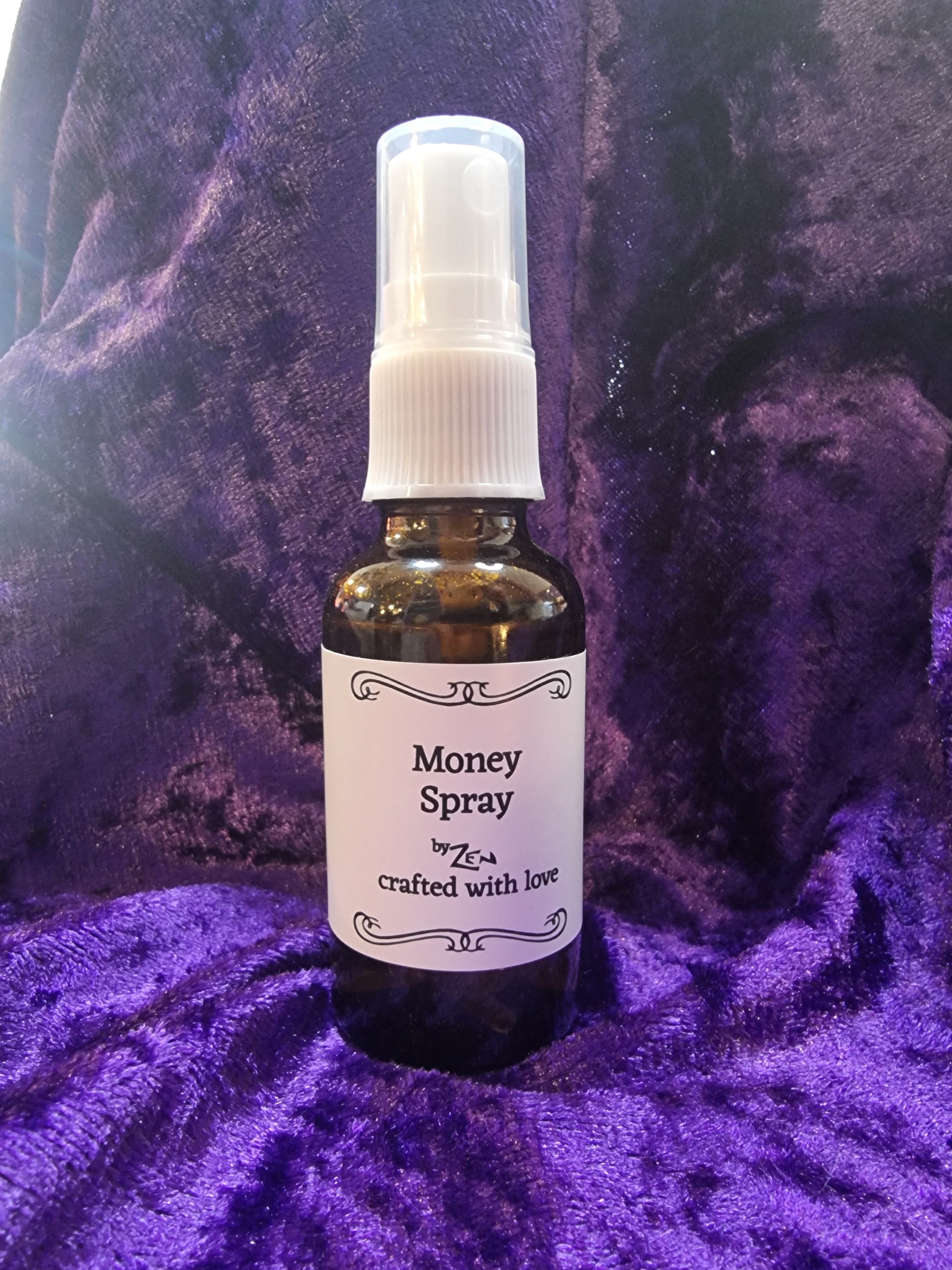 Bottle of Monks Spray on a purple textured surface