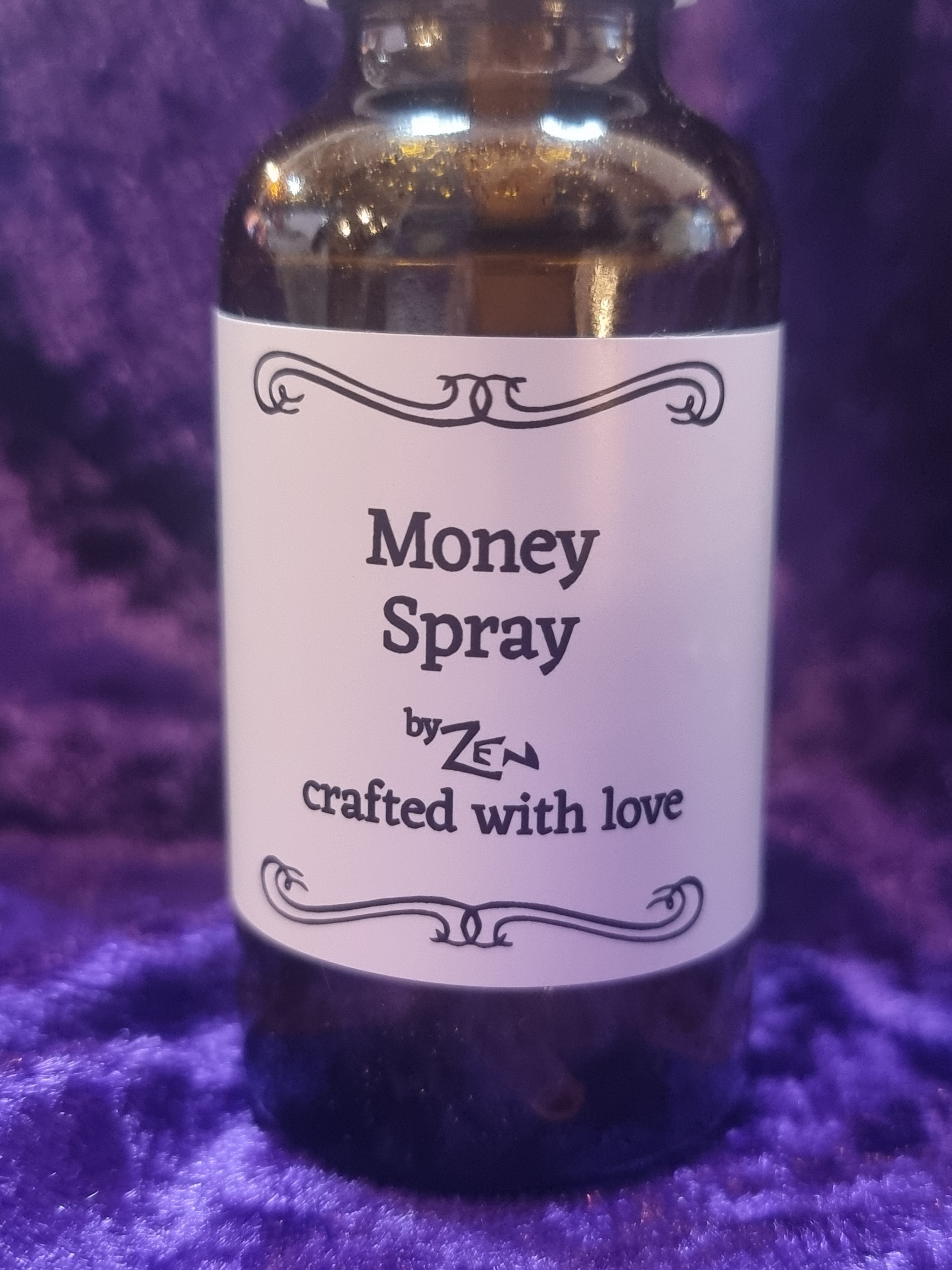 Bottle labeled 'Money Spray' on a purple textured background