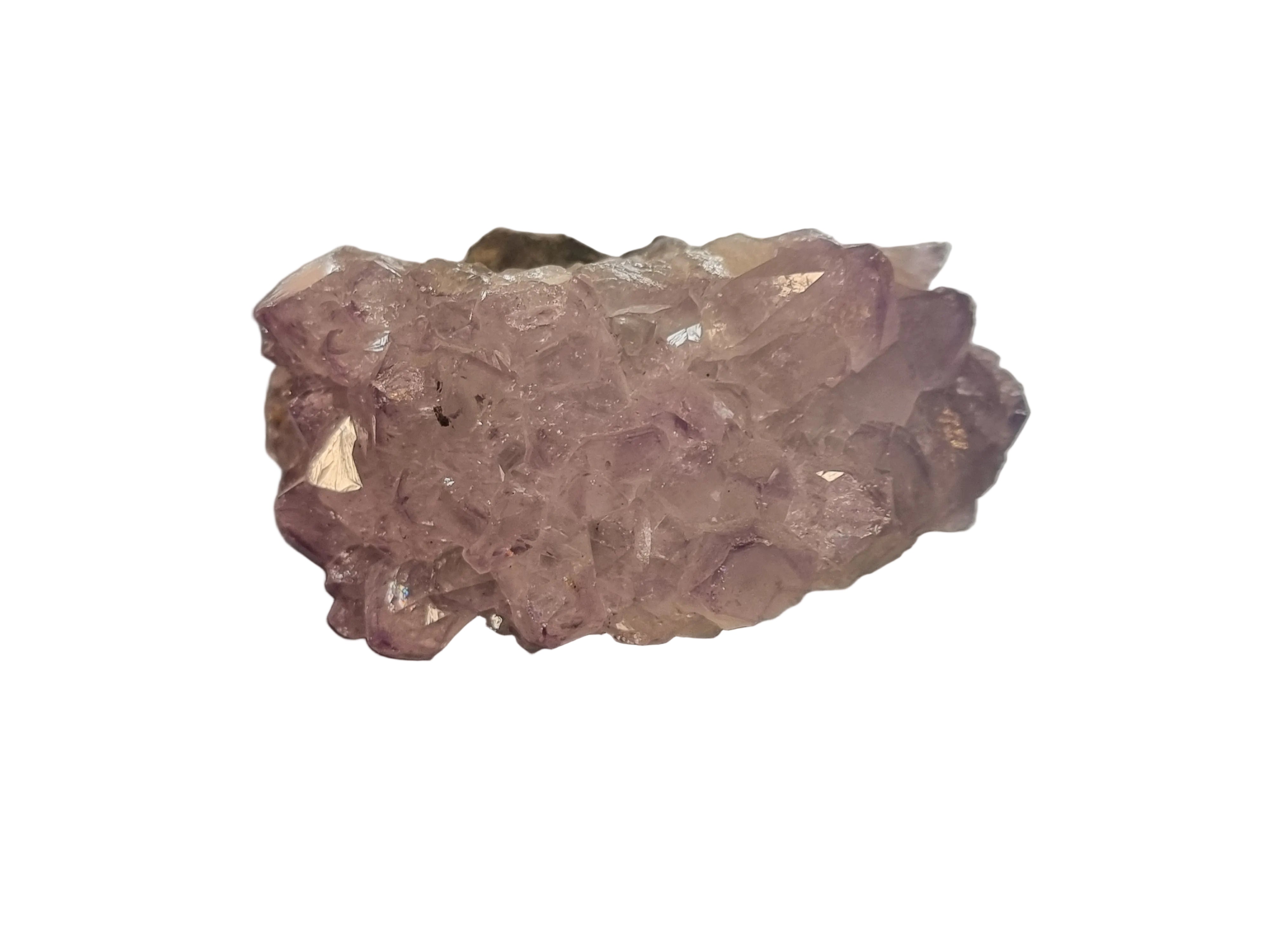 Amethyst crystal on a dark surface with a blurred background