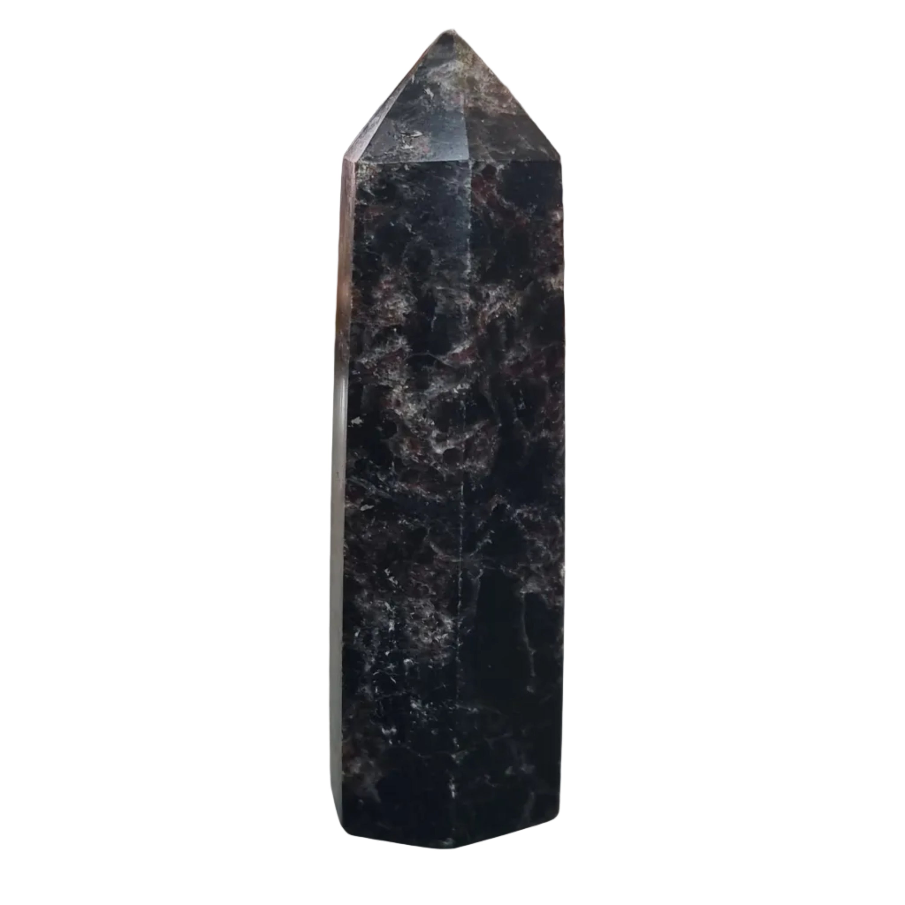 Black crystal tower on a reflective surface with a blurred background